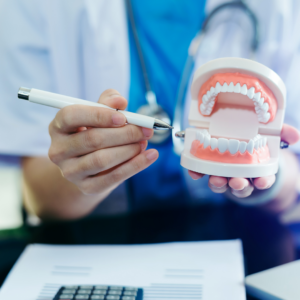 dentist showing a dental care plan